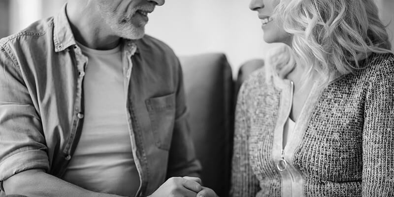 Partial shot of couple in relaxed conversation