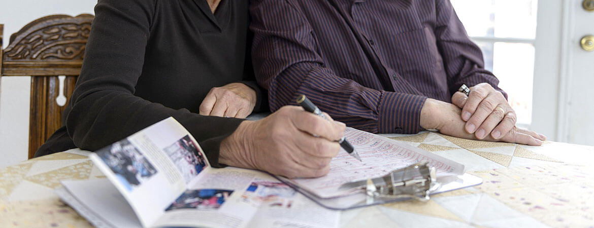 Retired people looking at paperwork image