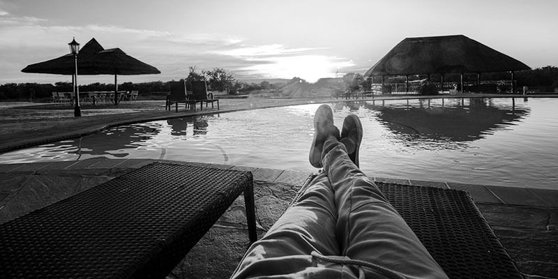 Relaxing on a sun lounger with a view of a pool